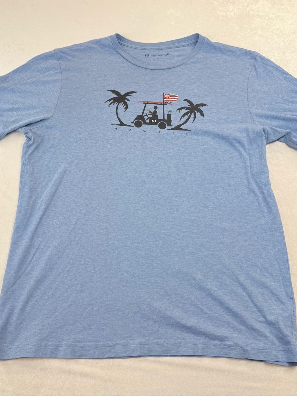 Travis Mathew Light Blue Short-Sleeve Tee with Golf Cart Graphic